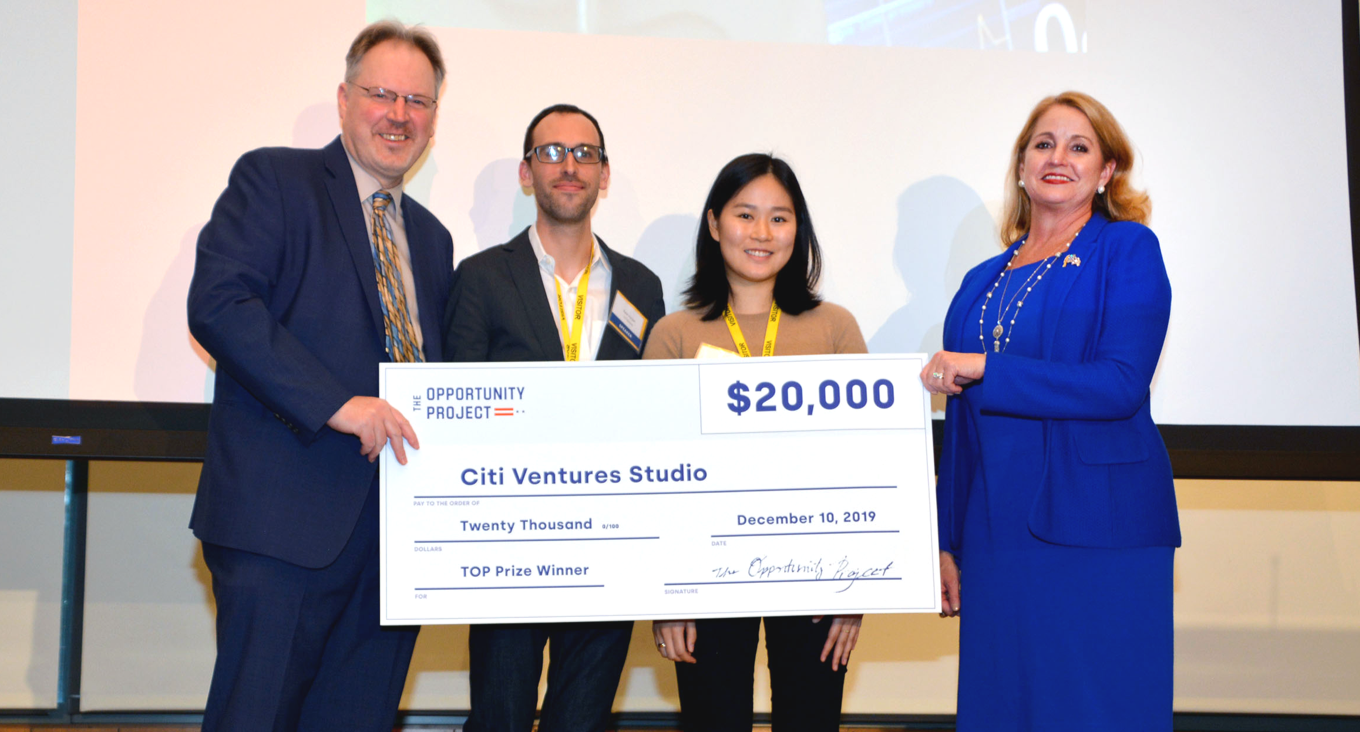 The Citi Ventures team at Demo Day presented with a big check prize of $20,000 for winning in one category of the 2019 TOP Prize Competition