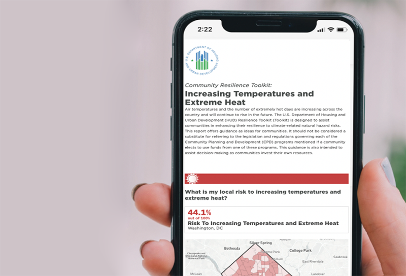 Hand holding a phone with an app that displays a map of DC about temperature risk